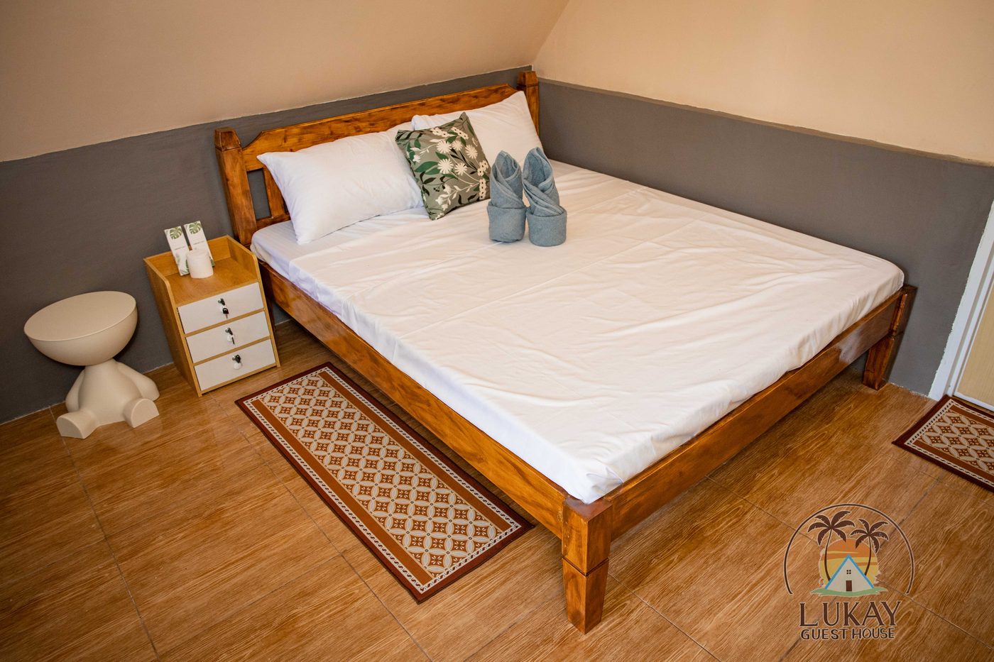 The bedroom with a bedside table and soft lighting
