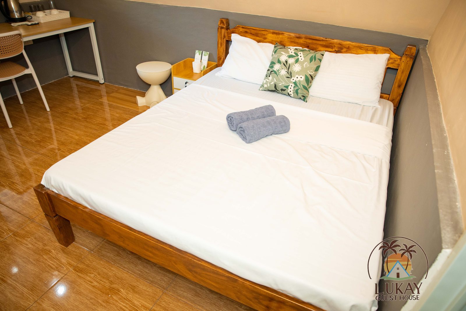 Interior of the A-frame cabin with a queen bed and fresh linens