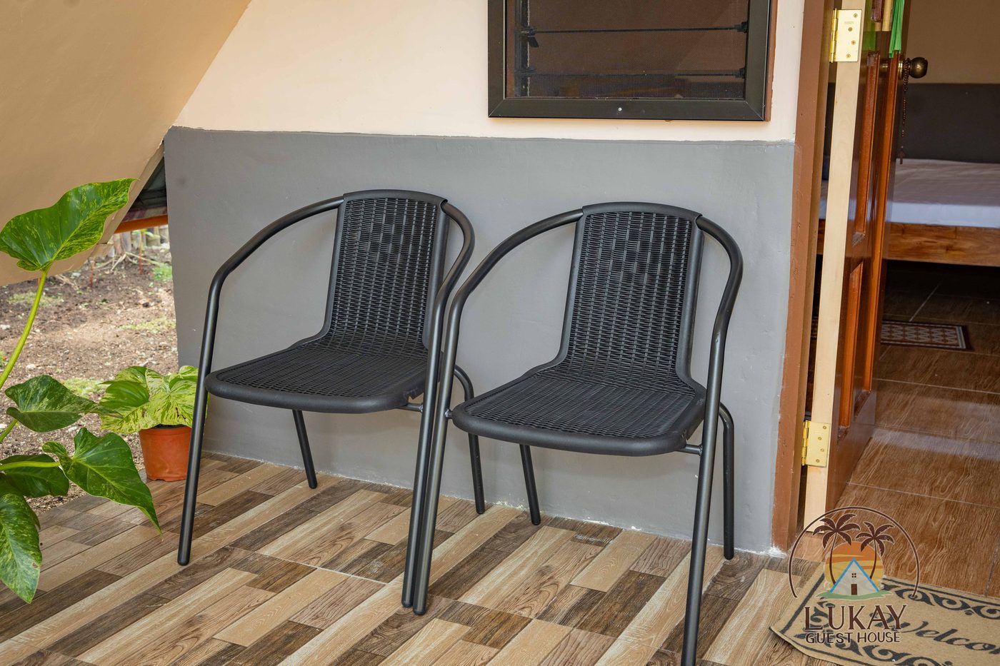 Private terrace with chairs beside the cabin
